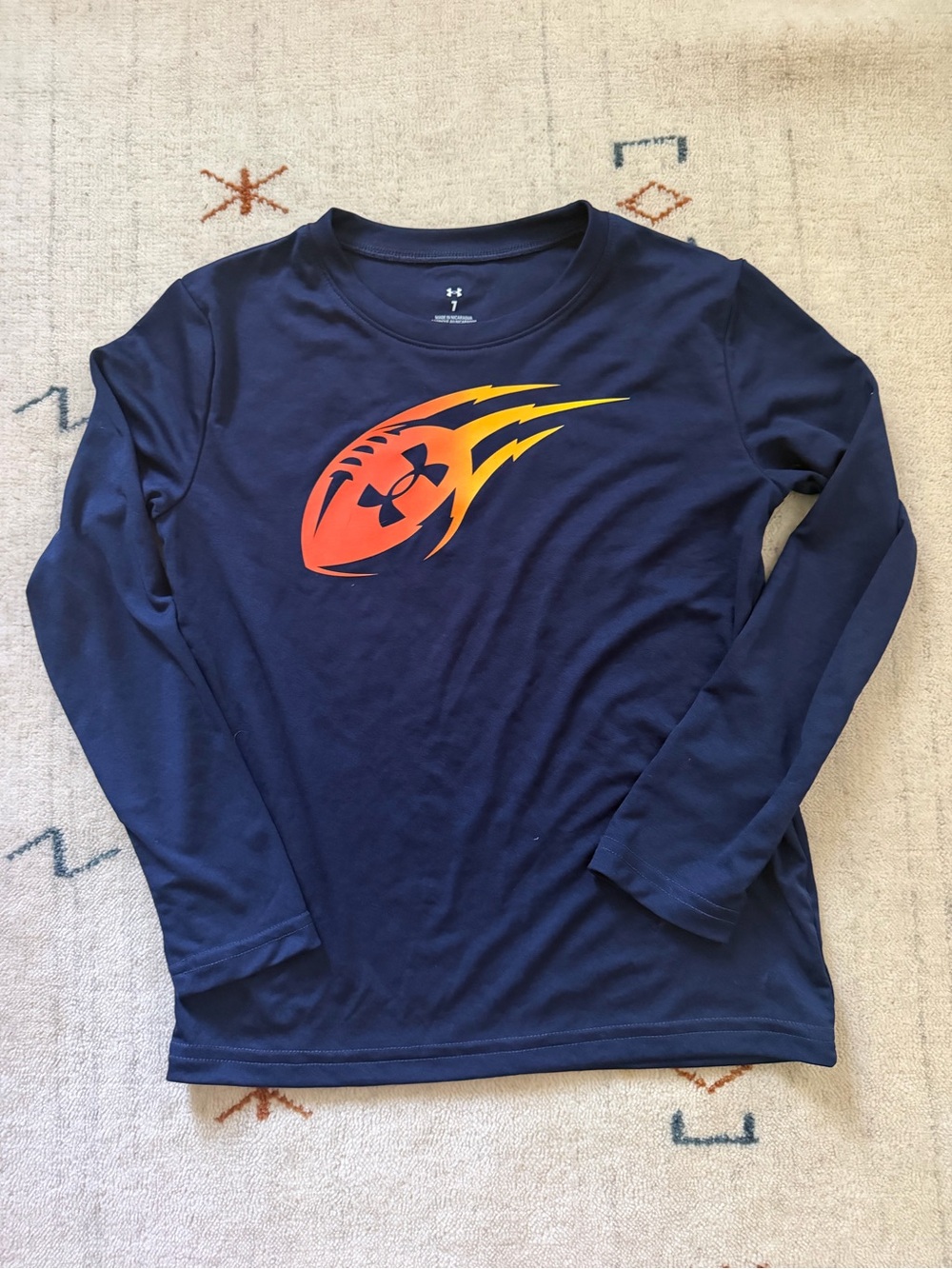 Buys Under Armour blue long sleeve football shirt, size 7